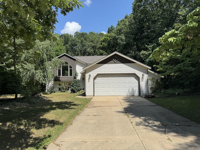 3175 Marcia Ln, Hamilton, MI 49419 - view of front of house featuring an attached garage, driveway, and a front yard