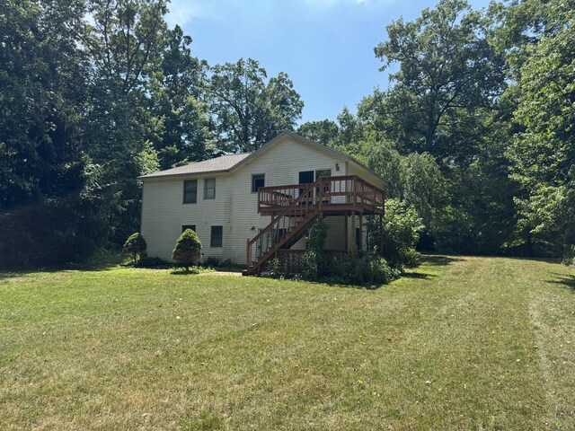 3175 Marcia Ln, Hamilton, MI 49419 - back of property featuring stairs, a deck, and a lawn