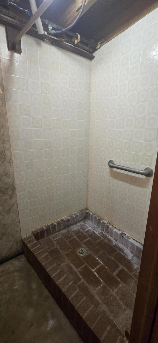 bathroom with a shower stall