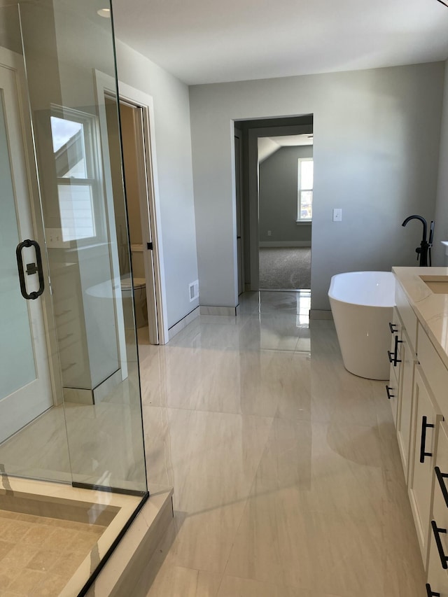 full bath featuring marble finish floor, visible vents, a freestanding bath, vanity, and walk in shower