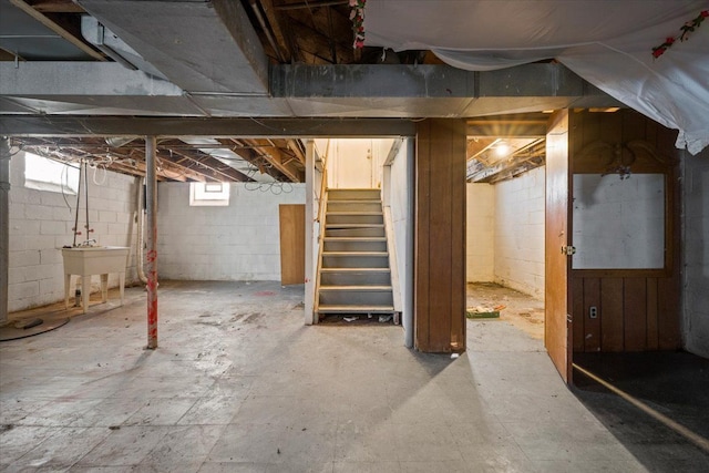 below grade area featuring a sink and stairway