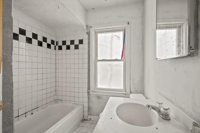 full bath featuring a sink and tile patterned floors