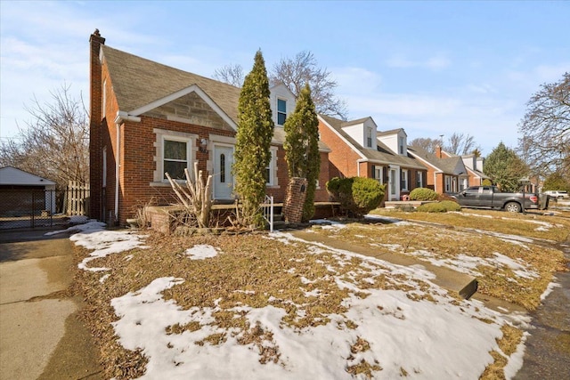 view of front facade with brick siding and a residential view