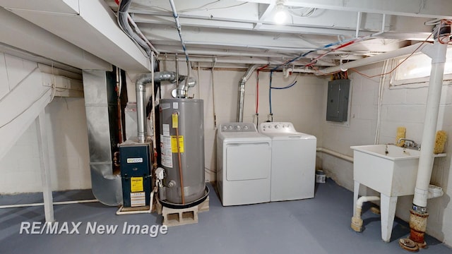 unfinished basement with electric panel, water heater, independent washer and dryer, and heating unit