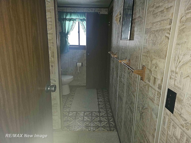 bathroom featuring toilet and tile patterned floors