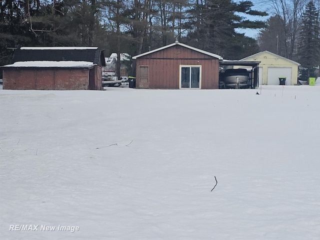 exterior space featuring a garage and an outdoor structure