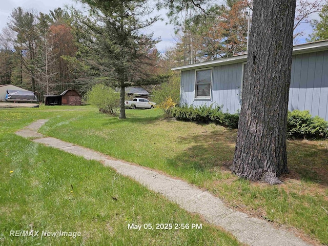 5243 Martin Rd, Beaverton, MI 48612 - view of green lawn featuring a storage unit