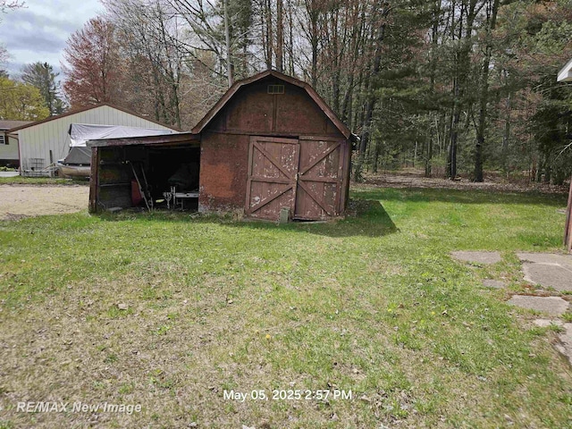 5243 Martin Rd, Beaverton, MI 48612 - view of barn featuring a lawn