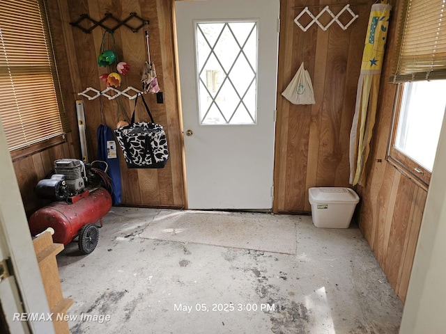 5243 Martin Rd, Beaverton, MI 48612 - entryway with plenty of natural light and wooden walls