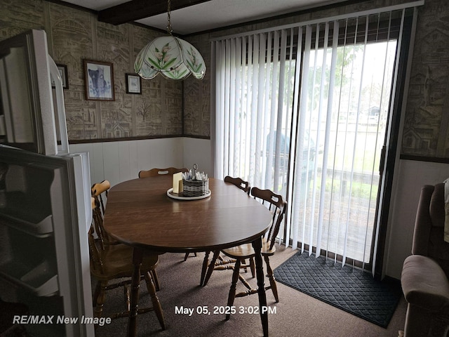 5243 Martin Rd, Beaverton, MI 48612 - carpeted dining area featuring wainscoting and wallpapered walls