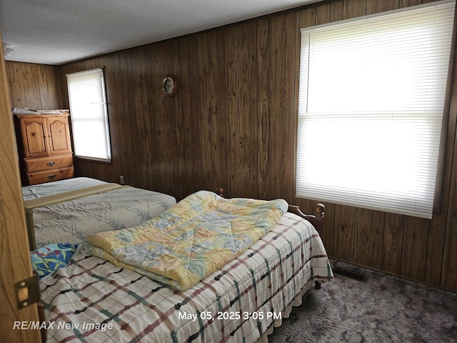 5243 Martin Rd, Beaverton, MI 48612 - bedroom featuring carpet flooring and wooden walls