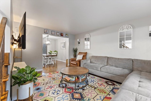 living area with wood finished floors and baseboards