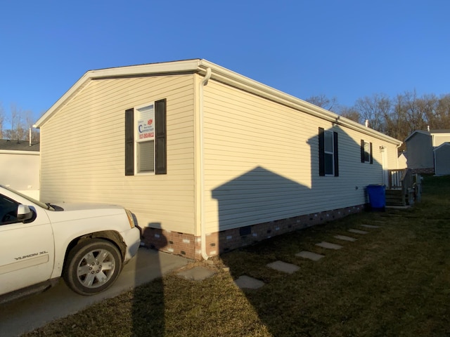 view of side of property with crawl space