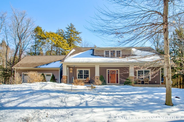 view of front of house featuring a garage and a porch