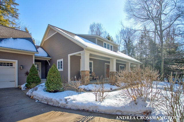 view of front of house featuring covered porch and an attached garage