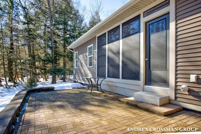 exterior space featuring entry steps and a patio area