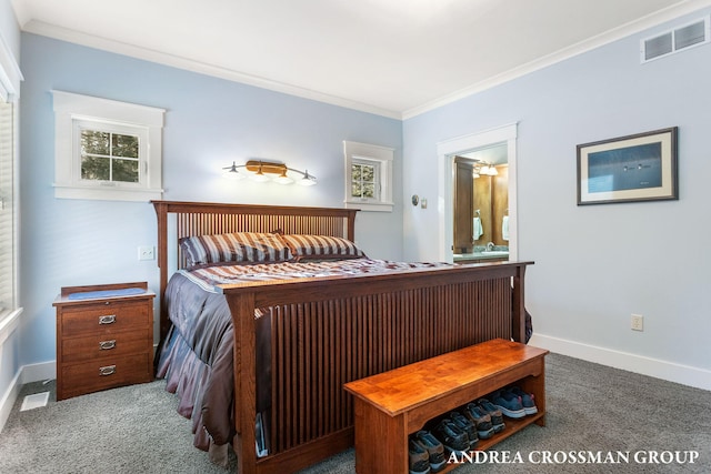 carpeted bedroom with ensuite bathroom, ornamental molding, visible vents, and baseboards