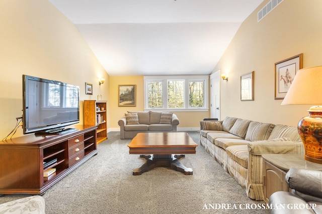 living area with high vaulted ceiling, carpet, visible vents, and baseboards