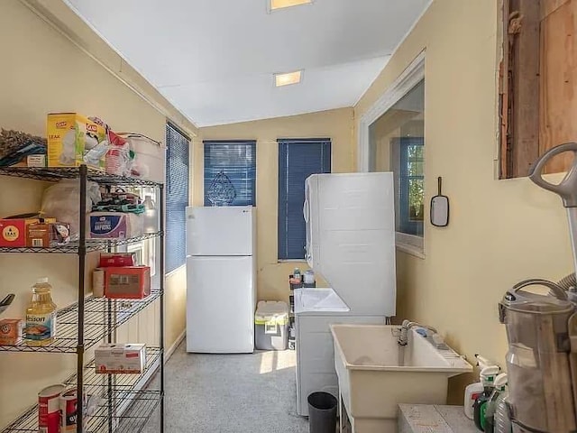 interior space featuring stacked washing maching and dryer