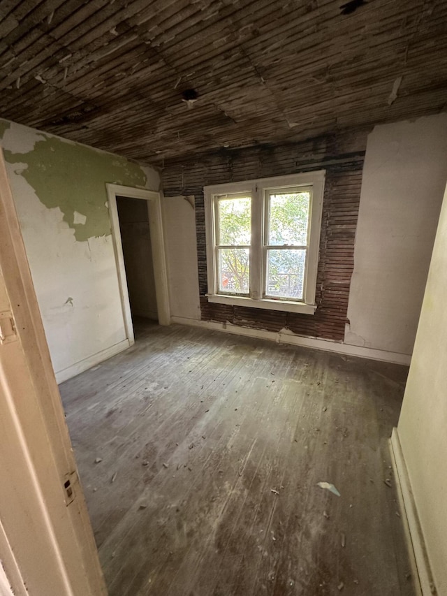 interior space featuring wooden ceiling and hardwood / wood-style flooring