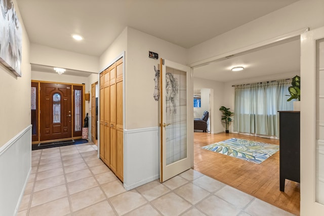 foyer entrance featuring light tile patterned floors