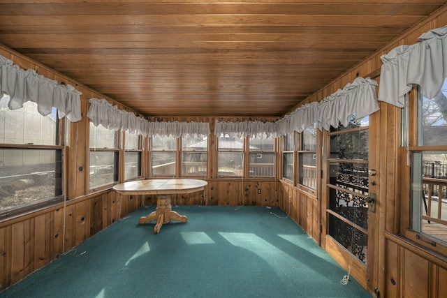 unfurnished sunroom with wood ceiling