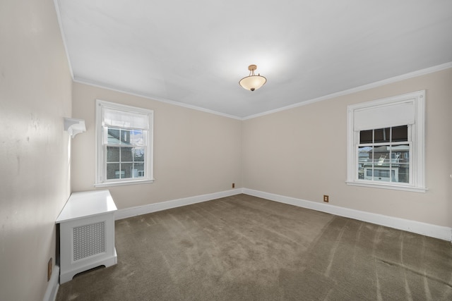 carpeted spare room with baseboards and ornamental molding