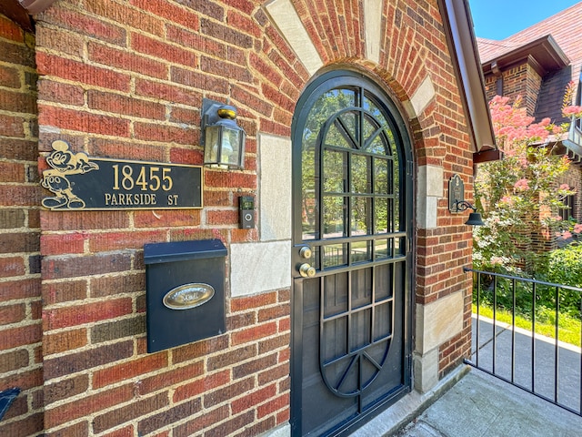 property entrance with brick siding