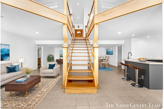 760 Bridgeview Bay Dr, Norton Shores, MI 49441 - stairway with tile patterned flooring and recessed lighting