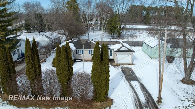 snowy aerial view featuring a residential view