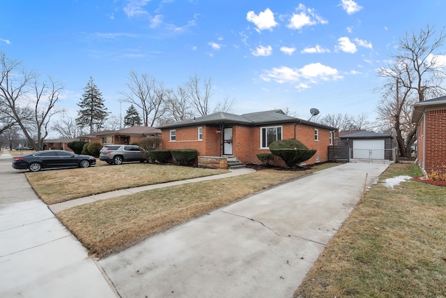 view of front facade featuring a garage, brick siding, an outdoor structure, concrete driveway, and a front yard