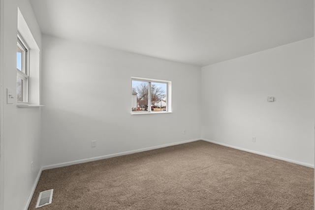27734 Lasslett St, Roseville, MI 48066 - carpeted empty room featuring baseboards, visible vents, and a wealth of natural light