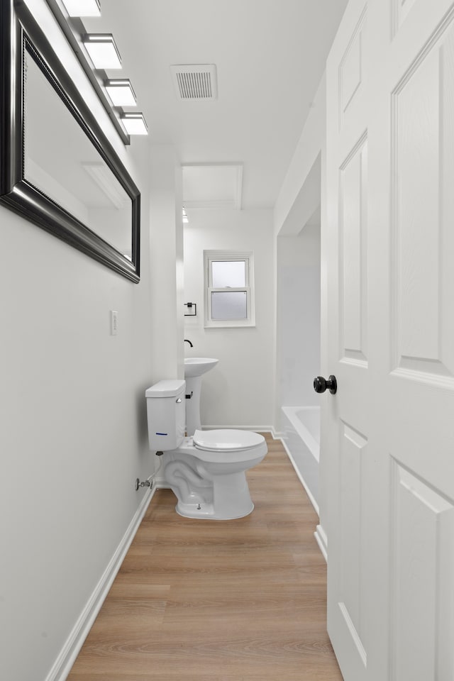 27734 Lasslett St, Roseville, MI 48066 - bathroom featuring baseboards, visible vents, toilet, and wood finished floors