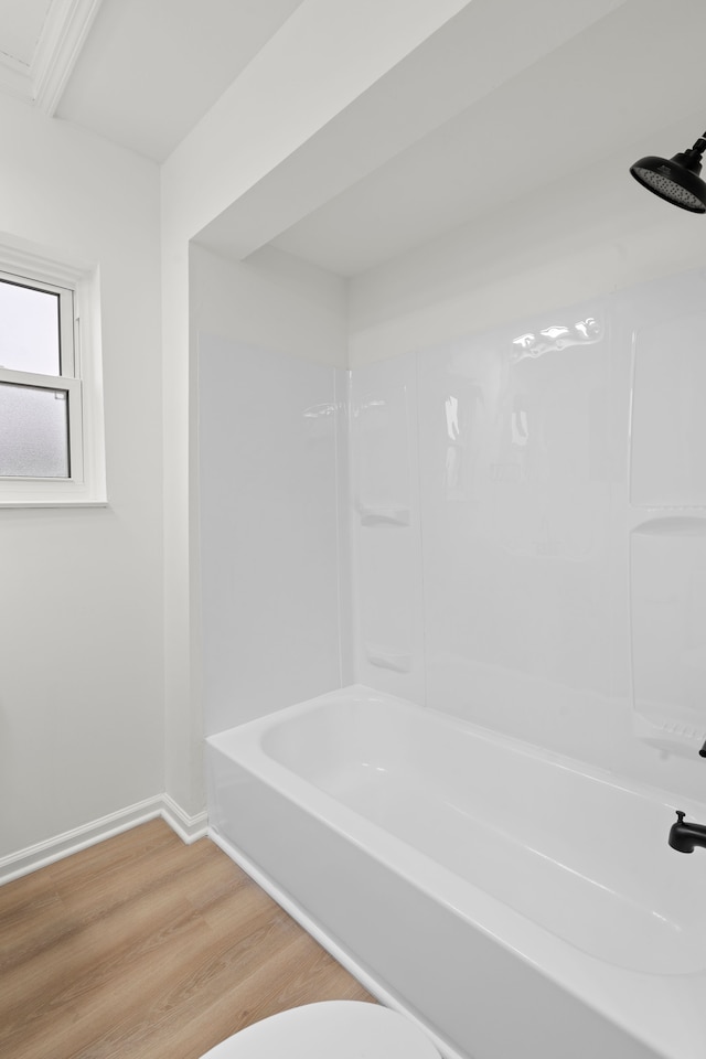 27734 Lasslett St, Roseville, MI 48066 - full bathroom featuring wood finished floors, bathing tub / shower combination, and baseboards