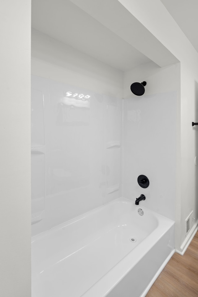27734 Lasslett St, Roseville, MI 48066 - full bath with shower / bath combination, visible vents, and wood finished floors