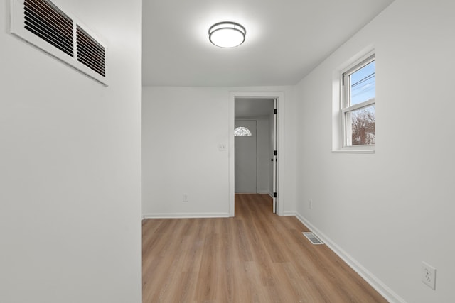 27734 Lasslett St, Roseville, MI 48066 - hallway featuring visible vents, light wood finished floors, and baseboards
