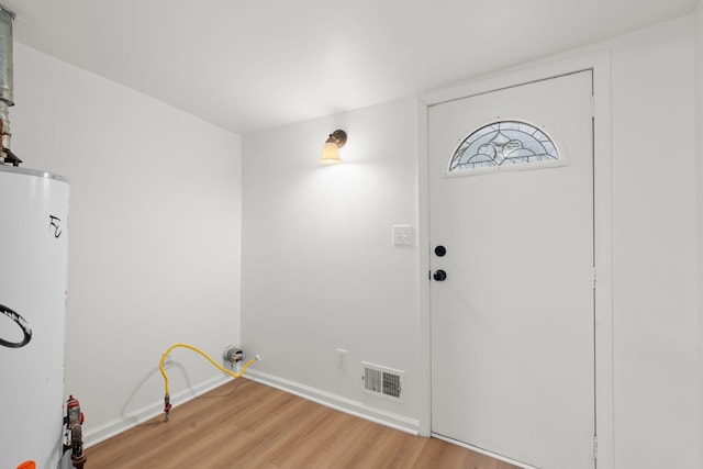 27734 Lasslett St, Roseville, MI 48066 - interior space featuring water heater, baseboards, visible vents, and light wood-style floors