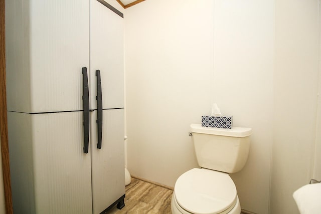 bathroom featuring toilet and wood finished floors