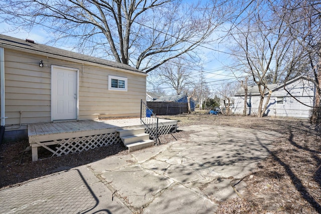 view of patio with fence and a wooden deck