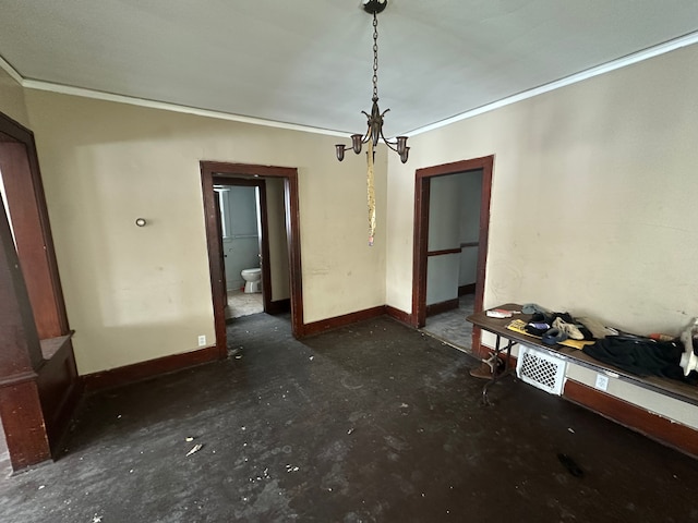 unfurnished dining area featuring baseboards, ornamental molding, and a notable chandelier