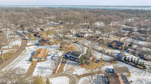 snowy aerial view with a residential view