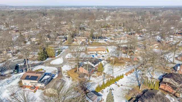 snowy aerial view featuring a residential view