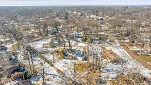 snowy aerial view featuring a residential view