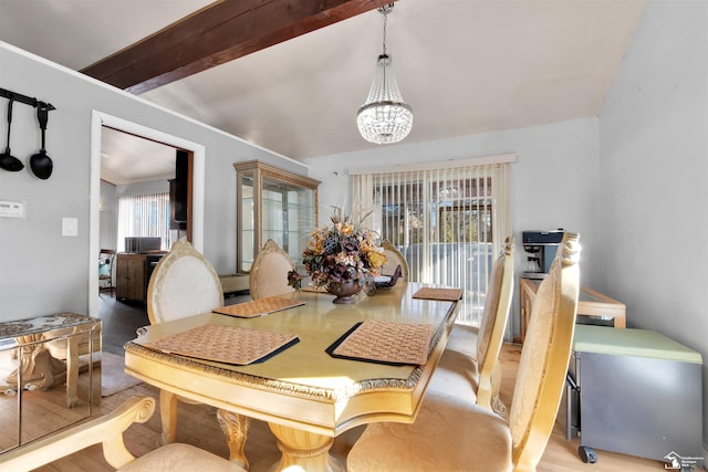 dining space with a chandelier, beamed ceiling, and light wood-style floors