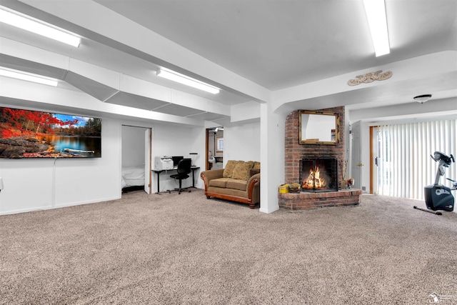 carpeted living area with a brick fireplace