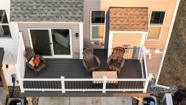 wooden terrace featuring an outdoor living space