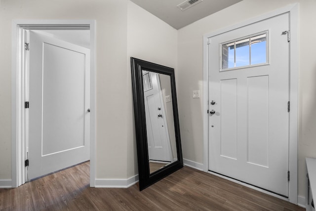 entryway featuring wood finished floors, visible vents, and baseboards