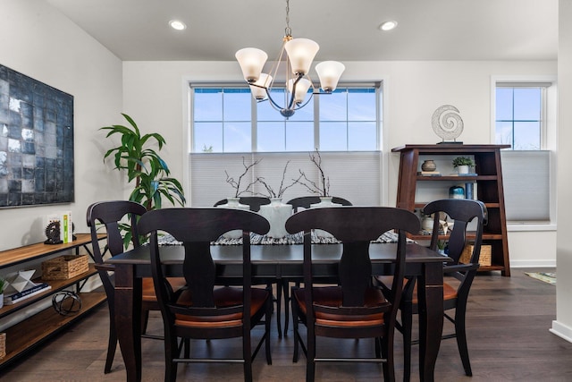 dining room with dark wood-style floors, recessed lighting, baseboards, and an inviting chandelier