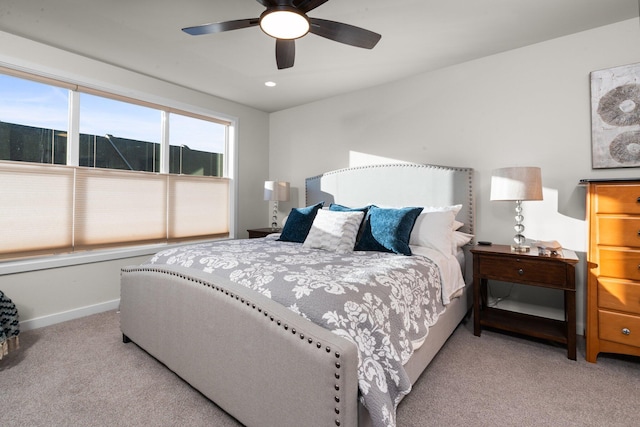 bedroom with recessed lighting, light colored carpet, ceiling fan, and baseboards