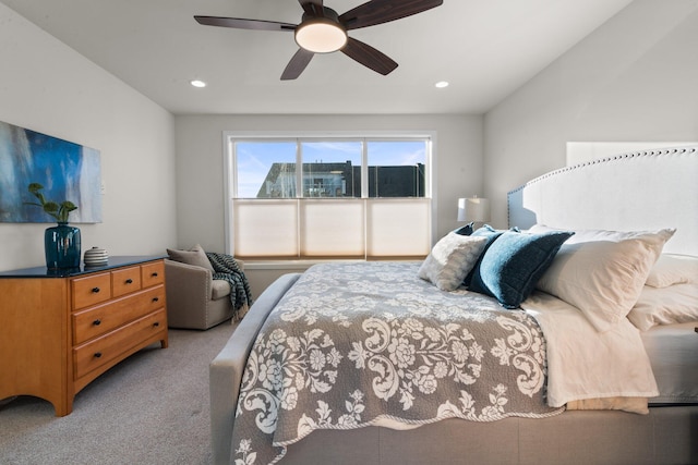 bedroom with ceiling fan, recessed lighting, and light colored carpet